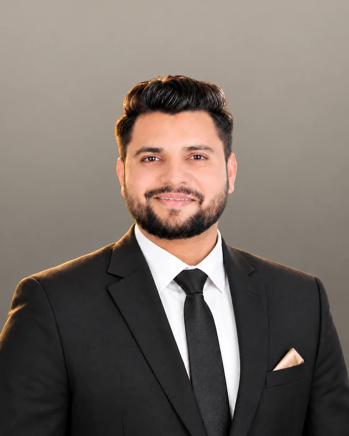 Rahul Singh, real estate salesperson, in a charcoal suit